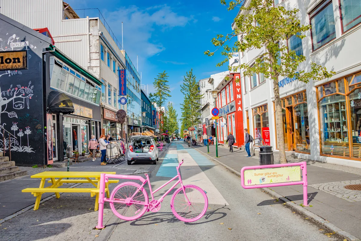 Food enthusiasts exploring Reykjavik's culinary scene on a guided food walk, tasting traditional Icelandic dishes and local delicacies