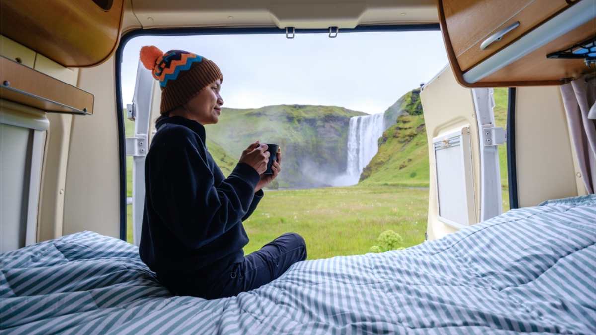 Woman camping right by Selfoss waterfall
