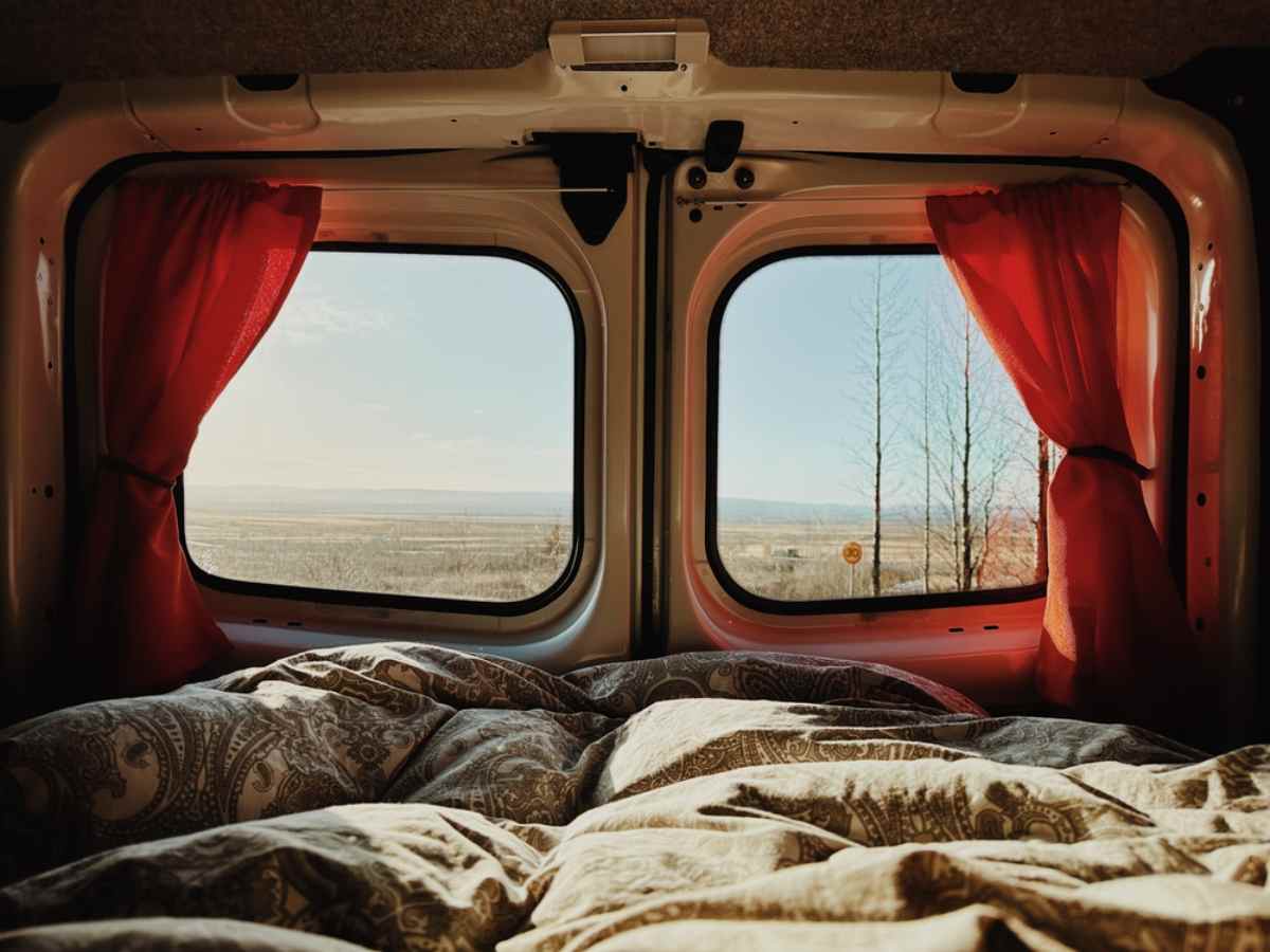 View from inside a camper of its windows with beautiful Icelandic scenery outside.