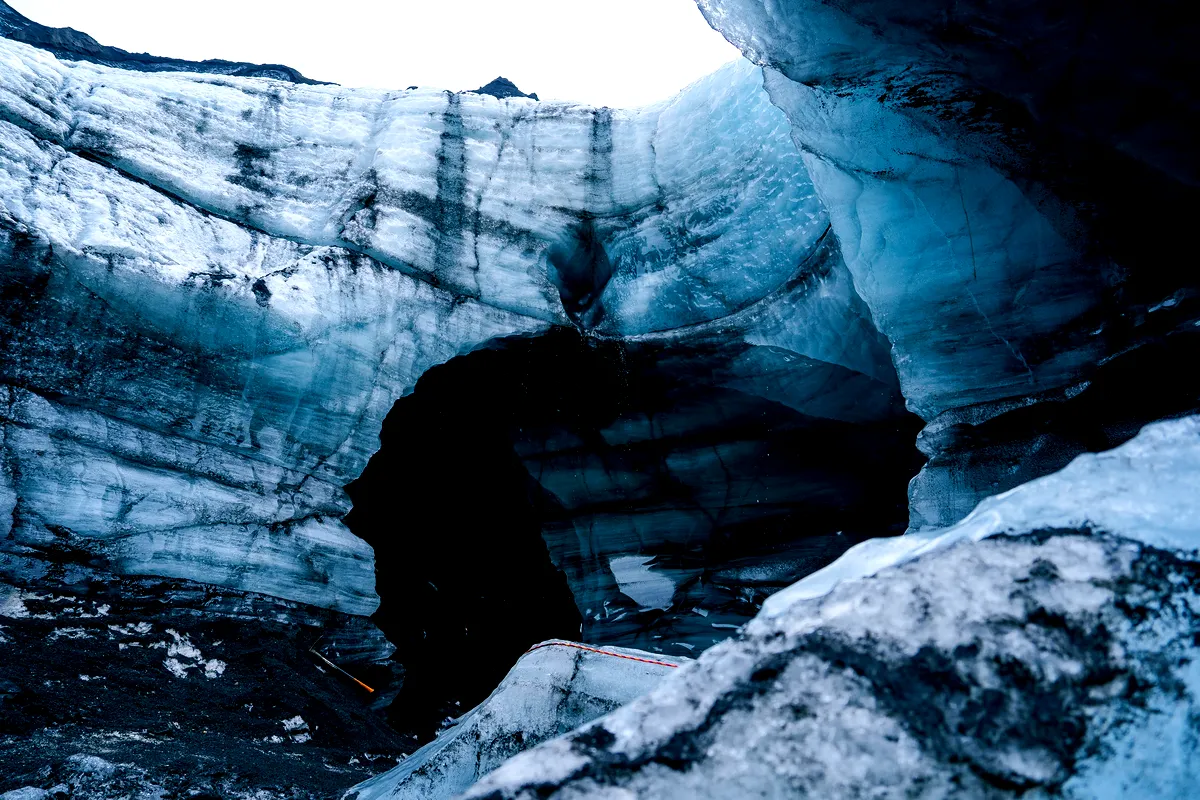 Close-up of the stunning entrance to Katla Ice Cave in Iceland, showcasing textured blue ice layers