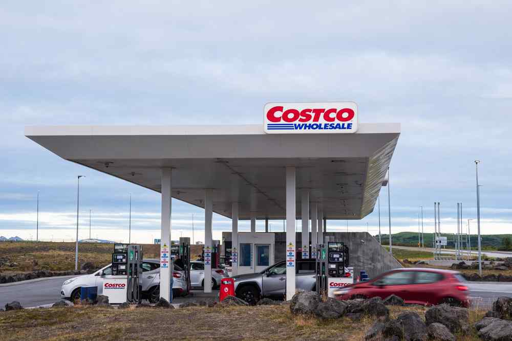 Iceland's Costco gas station Costco gas station in Iceland with cars at the pumps under a cloudy sky.