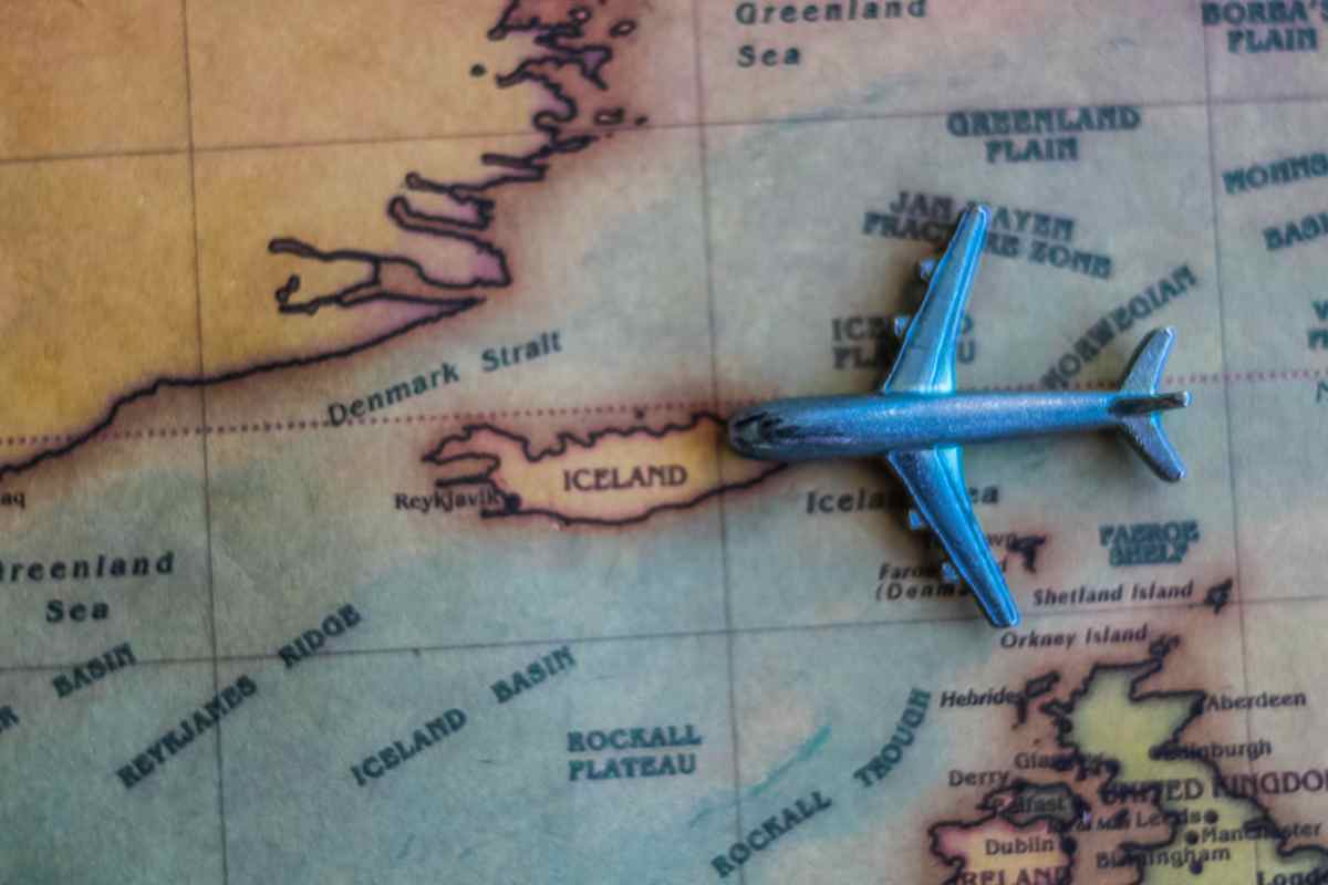 Toy plane arriving into Iceland on a map