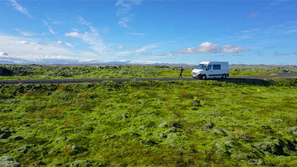 White camper on the green pastures of Iceland in spring