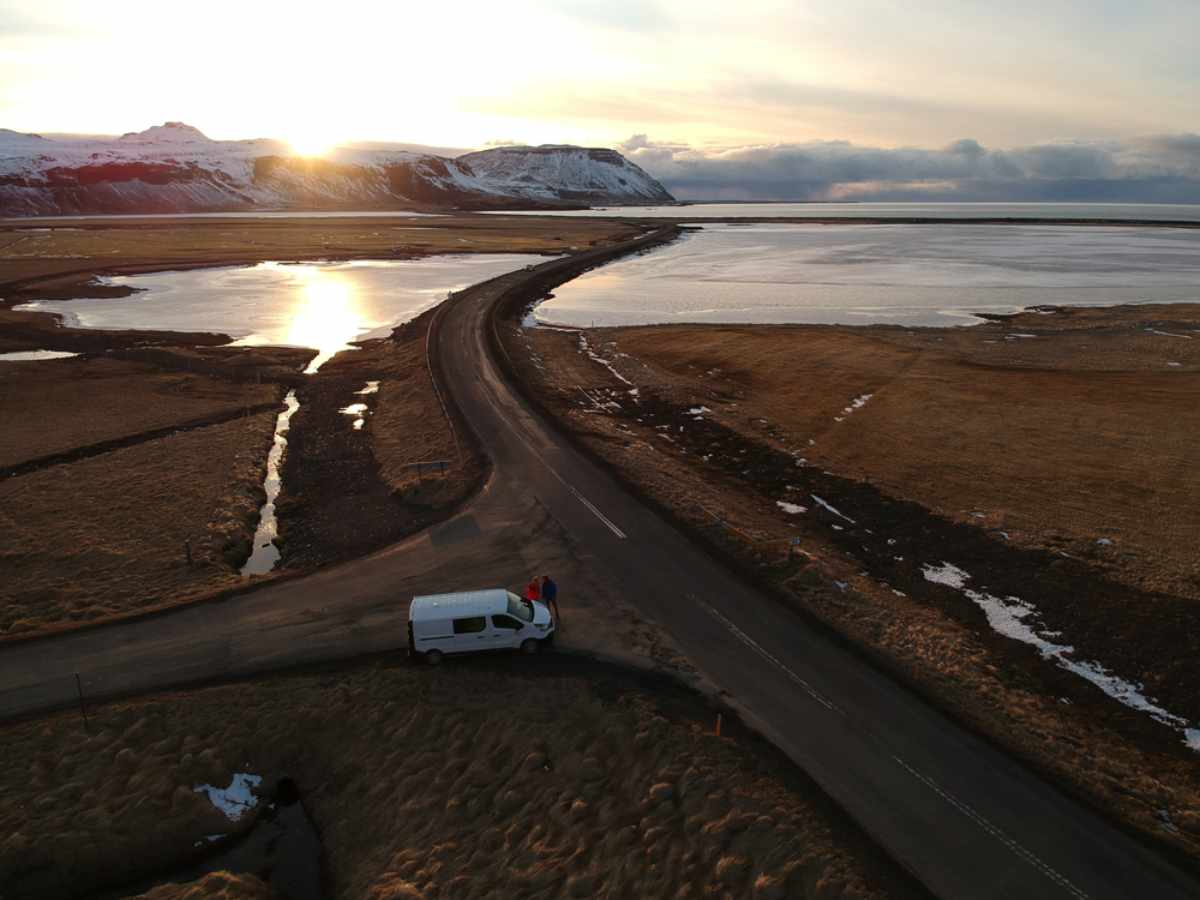 White campervan at a crossroad