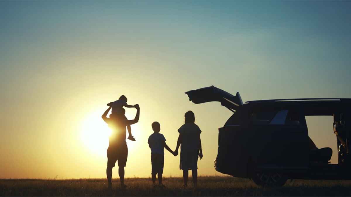 Family on a road trip in Iceland at dusk