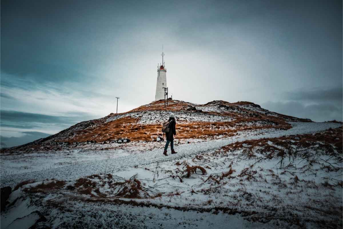 Reykjanesviti lighthouse on top of a hill covered in snow