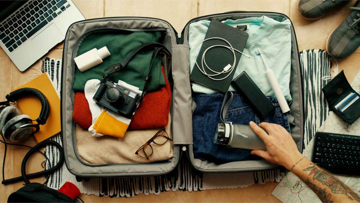 Suitcase filled with clothes and personal items for a trip to Iceland