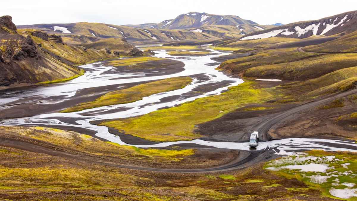 A camper crosses Iceland's so-called Yellow River on what looks like a journey with breathtaking views and undulating roads.