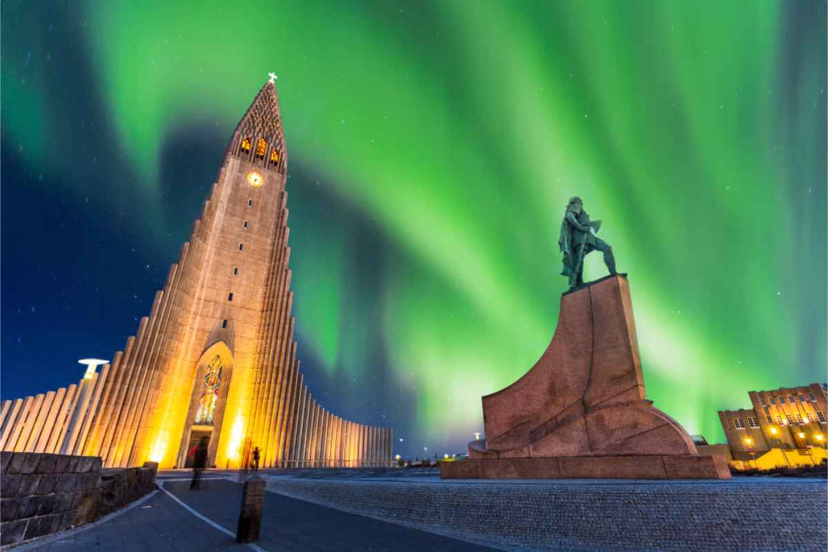 Northern lights dancing on top of Reykjavik´s main church