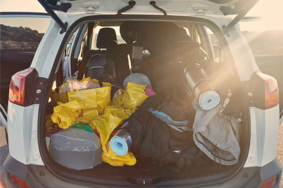 Trunk of a vehicle overfilled with stuff