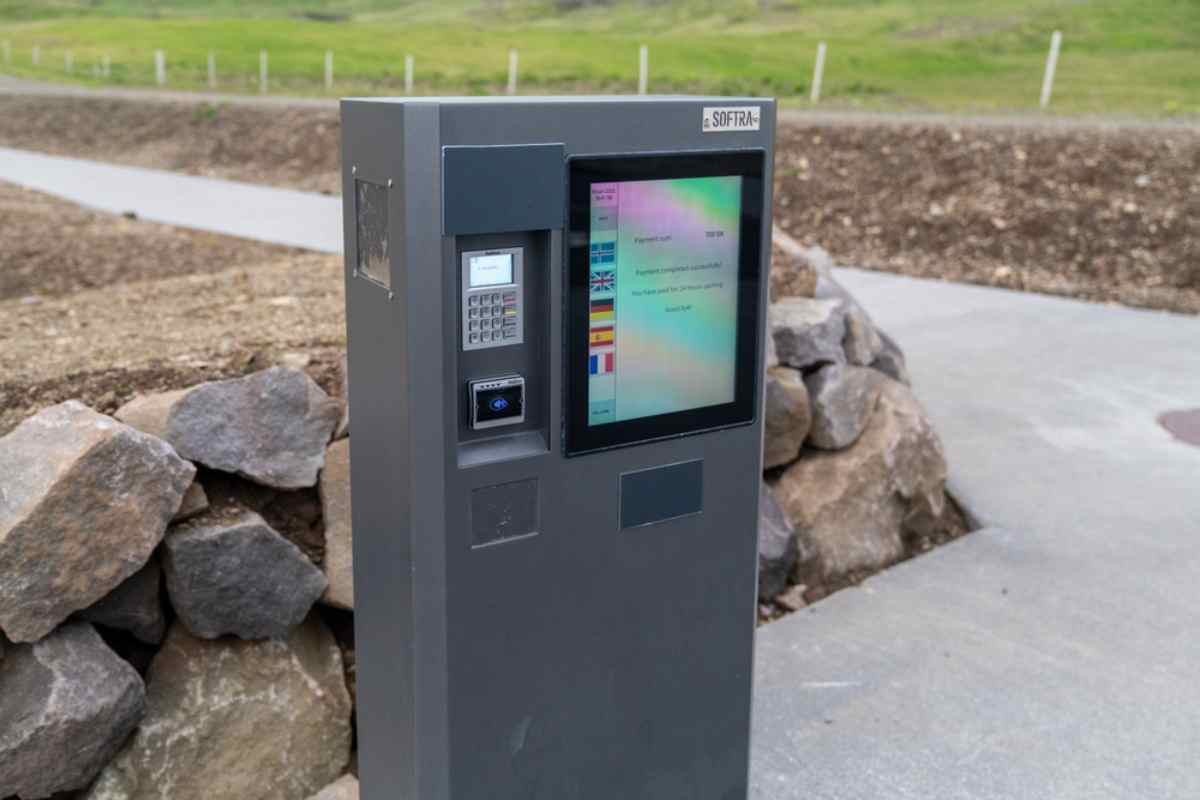 Self-service payment kiosk for parking or facilities at an outdoor site in rural Iceland.