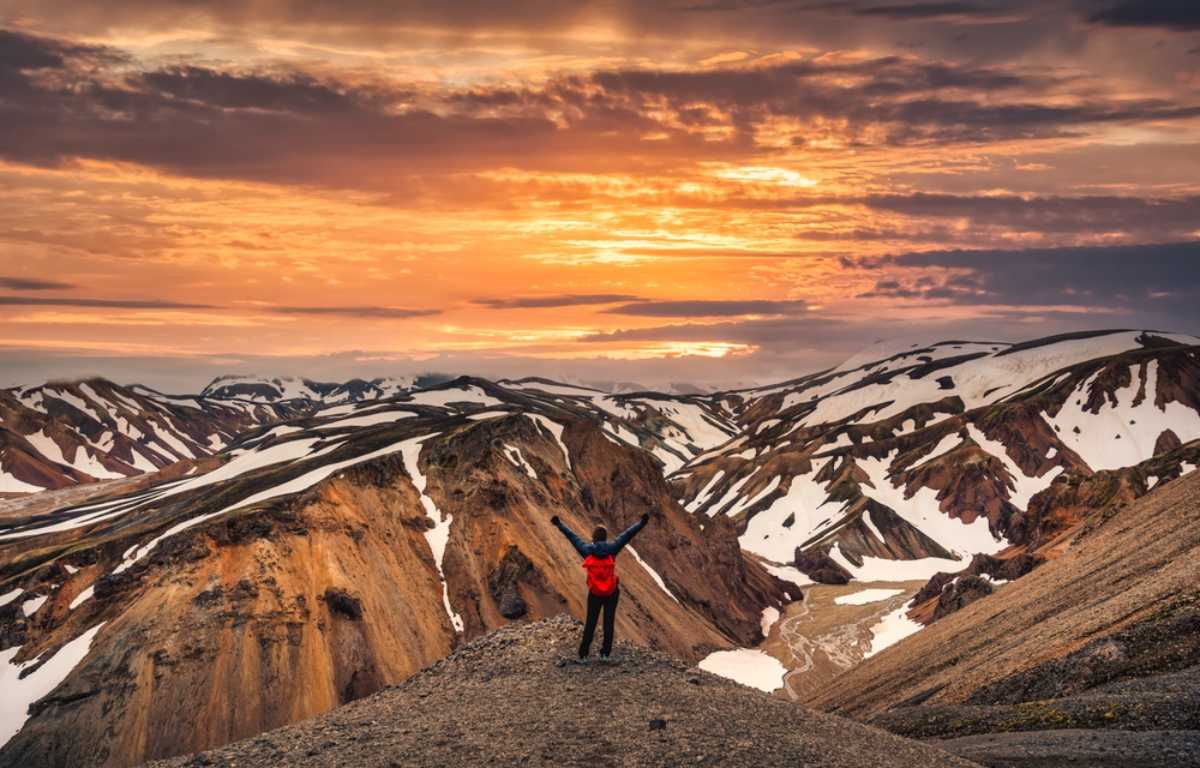 Hiker enjoying the views of Landmannalaugar at dusk