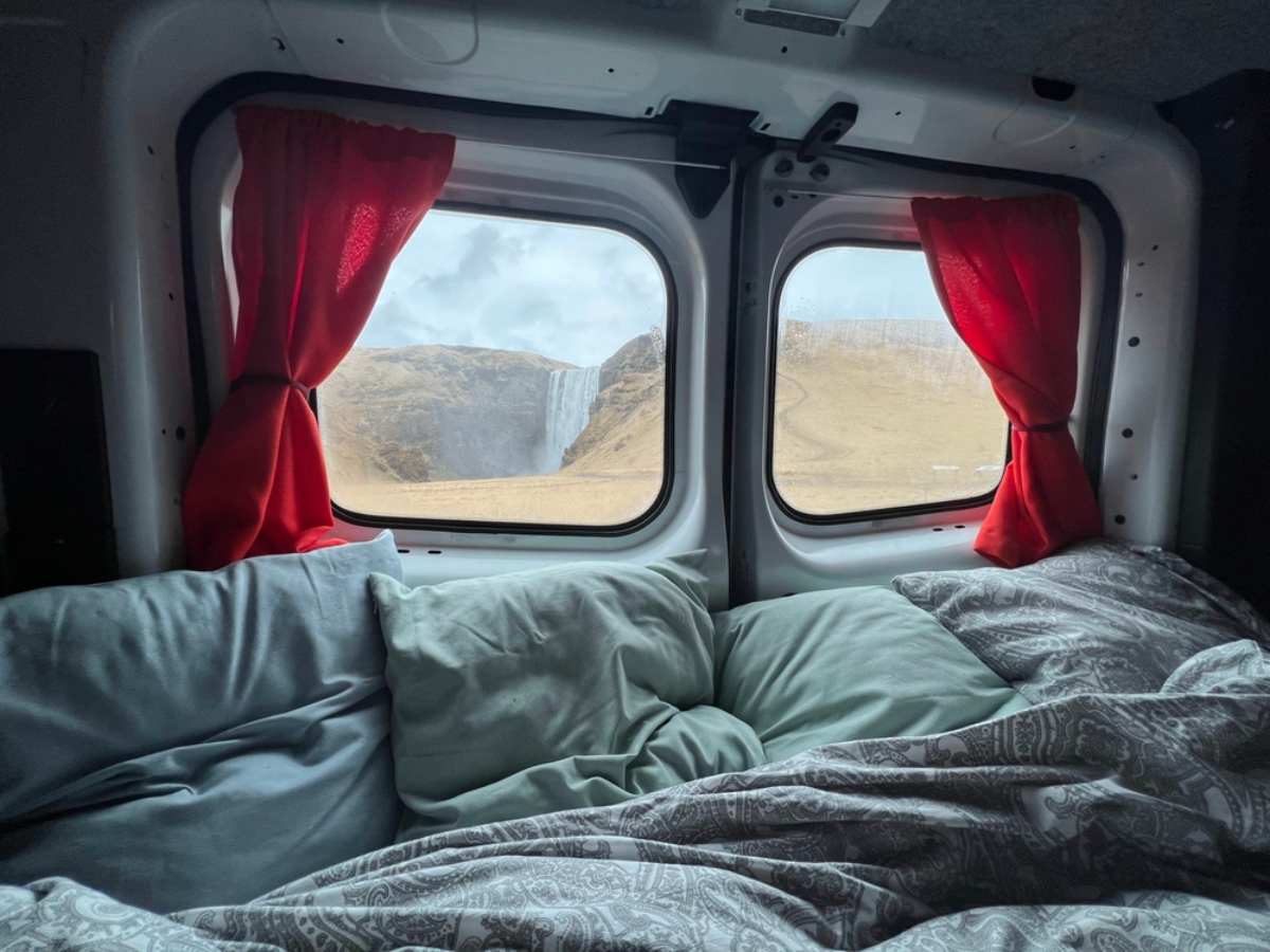 Skogafoss waterfall from the rear windows of a camper in Iceland