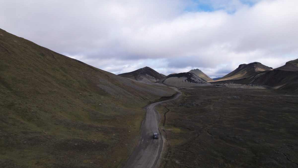 SUV driving through an F-Road in a remote volcanic area in Iceland