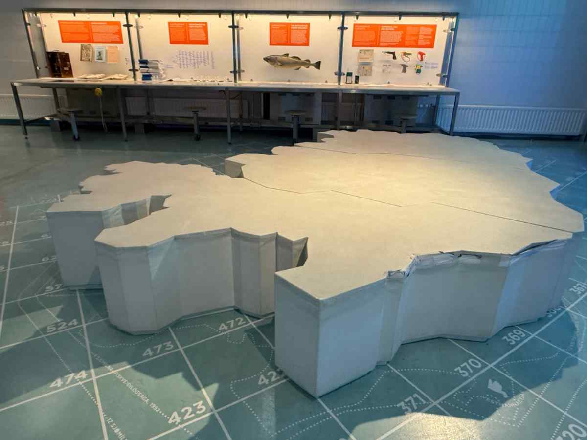 Access to museums in Reykjavik Museum exhibit with a large 3D map of Iceland.
