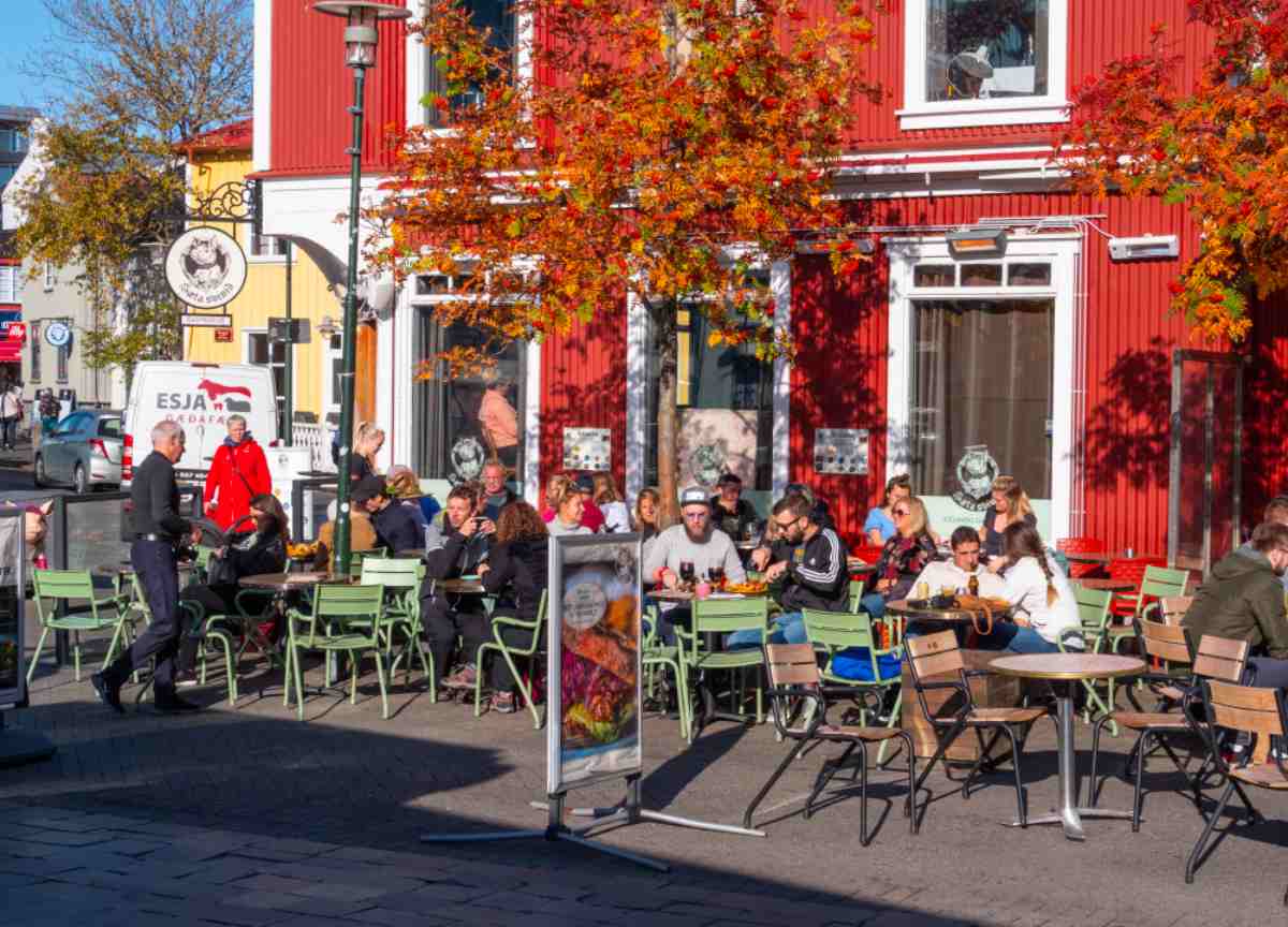 Enjoying local restaurants in Reykjavik Outdoor café in downtown Reykjavík with autumn colors.