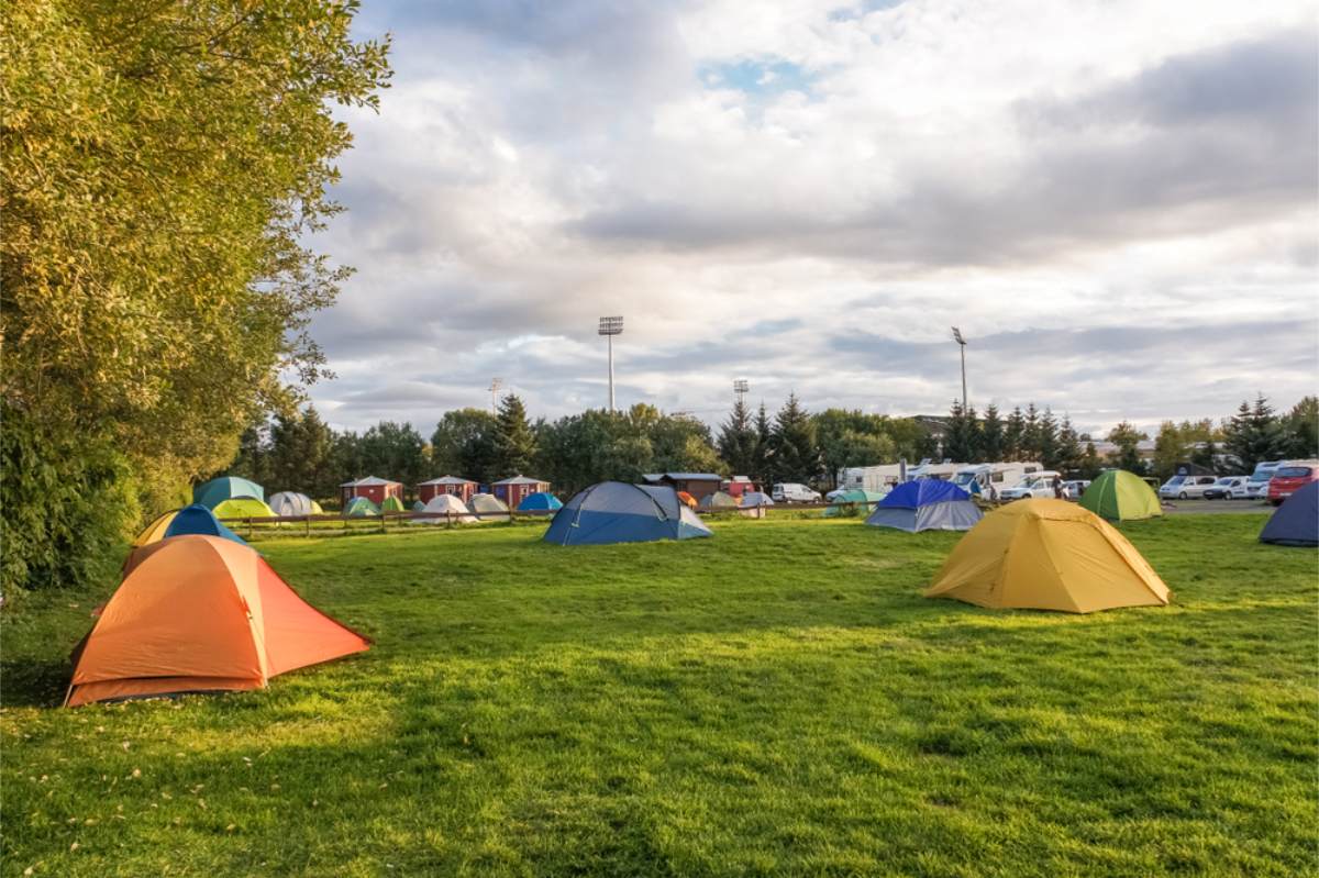 Camping trip in Iceland in June Several tents all set up in a campsite in Iceland