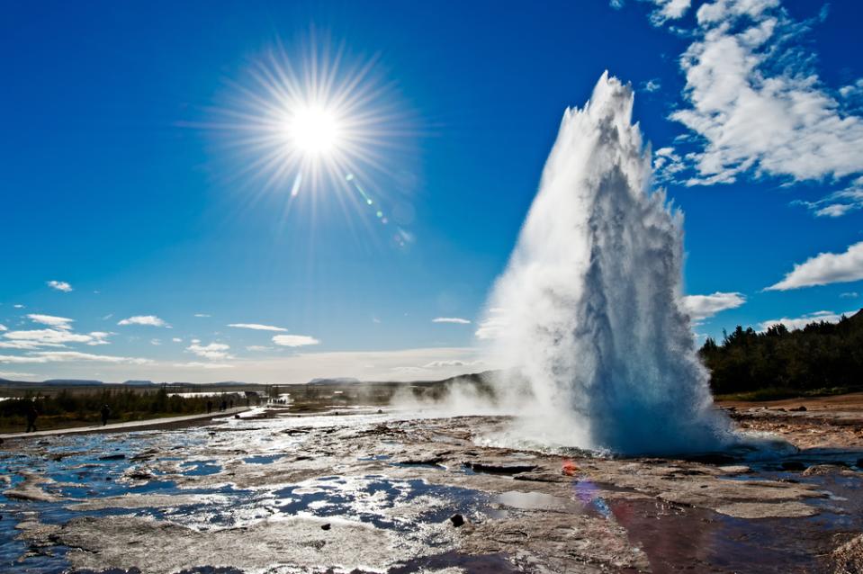 Best camper route for Iceland in June Icelandic geysir erupting on a sunny day