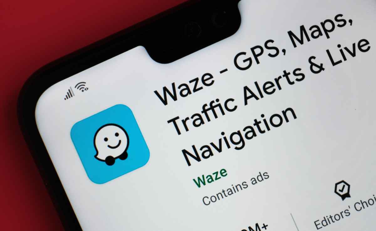 Close-up of the Waze app page on a smartphone showing GPS, maps, traffic alerts, and live navigation.