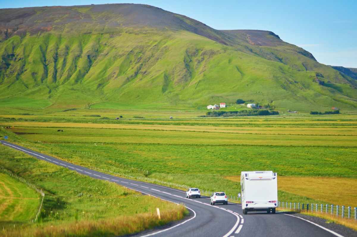 RV driving through Iceland's summer landscape