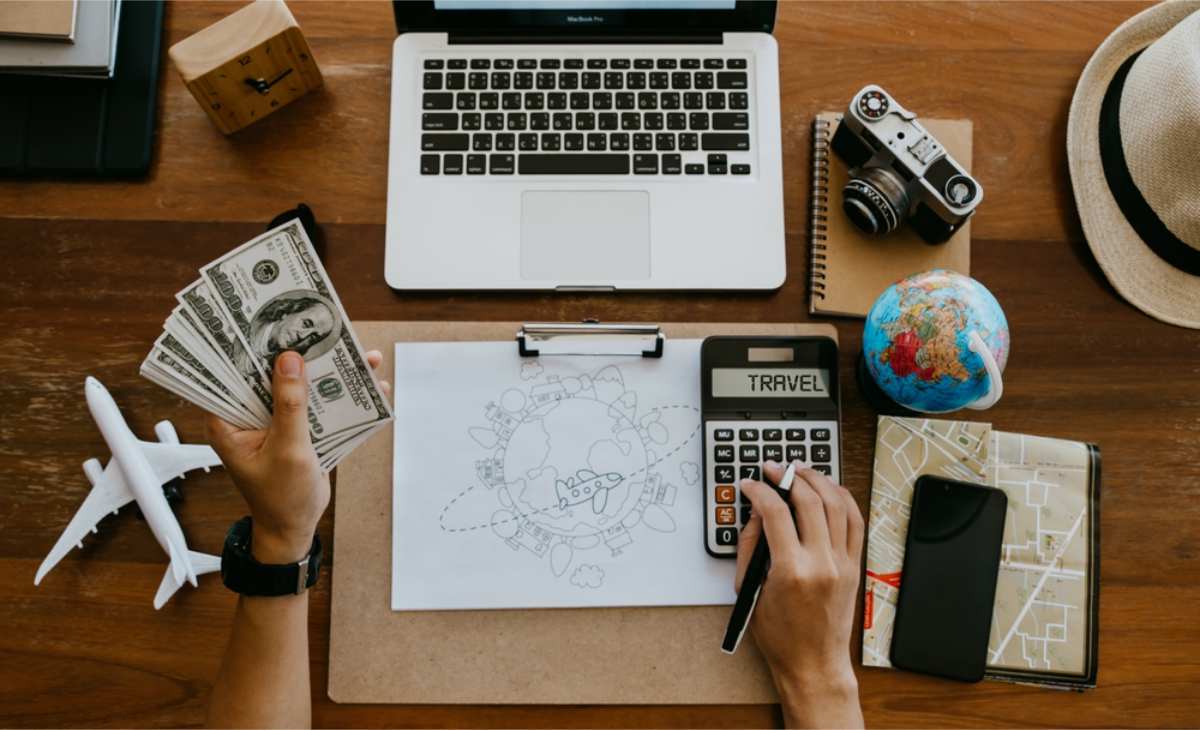Man doing calculations for his trip budget